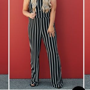 Black and white vertical stripper jumper.